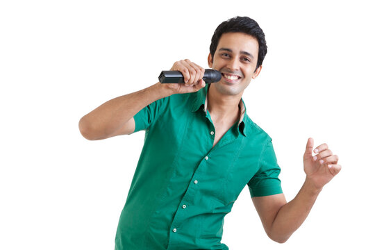 Portrait of young man with a microphone smiling