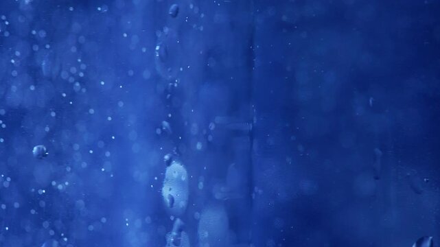 Rotating Glass Water Bottle with Condensation Droplets and Sparkling Bubbles - Refreshing Commercial Background⁠