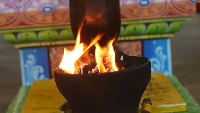 Sacred ritual fire burning in decorative setting