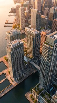 Aerial view of waterfront skyscrapers in coastal city.