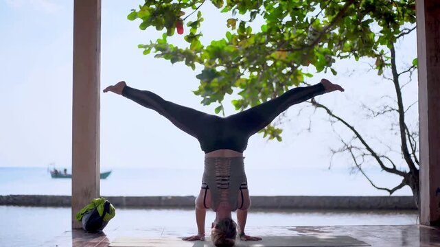 Woman Practicing Yoga Handstand on Beach at Sunset Outdoor Fitness and Wellness Animation