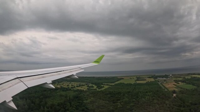 COPENHAGEN, DENMARK - JULY 1, 2024: airBaltic airplane touchdown and landing on airport runway