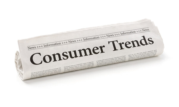 Rolled newspaper with the headline Consumer Trends