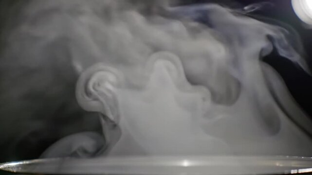 Smooth drifting smoke clouds moving naturally across a dark background, ideal for cinematic transitions, mystery scenes, and visual effects.