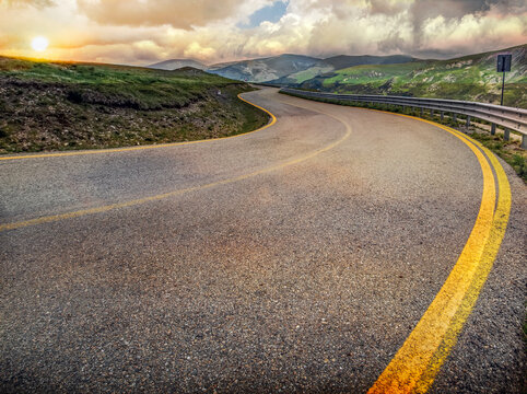 curves on the famous Transilvania road winding throught Romania in the Carpathians at sunset