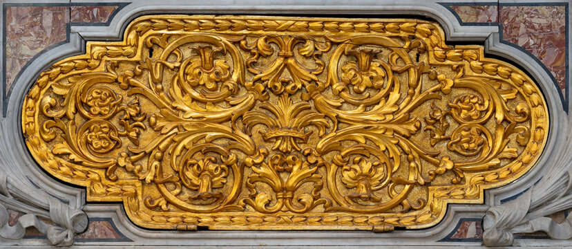 PIETRASANTA, ITALY - JUNE 24, 2026: The carved polychrome baroque relief on the side altar of church Catedralle di San Martino by Francesco Bergami (1677)