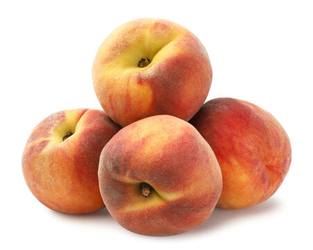 Pile of ripe peaches close-up on a white background. Isolated.