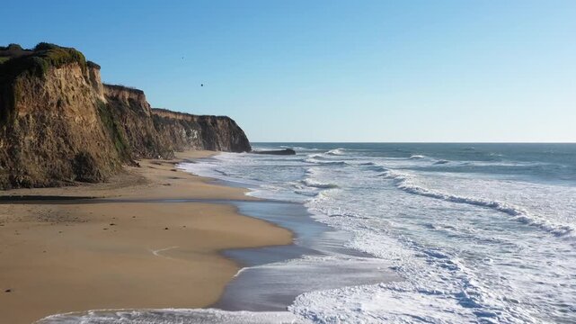 Half Moon Bay aerial flight surf to jagged cliffs 