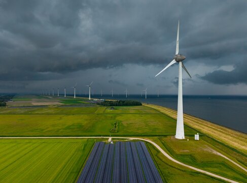 Thunderstorm over wind and solar farm in Noordoostpolder