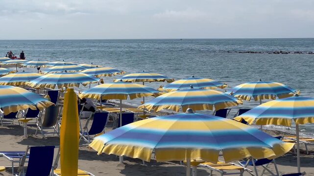 Ostia view of coast with beach umbrellas and chairs, Lido di Ostia, Roma, Lazio Italy.