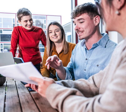 Teamwork and discussion during business meeting in modern office