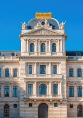 Fototapeta premium The grand facade of a massive royal residence features ornate windows and classical architecture under a clear blue sky on a bright day, art, formal, facade