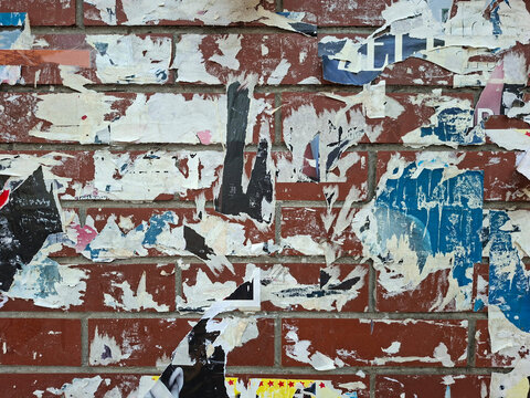 Torn and ripped urban textured paper poster grungy background