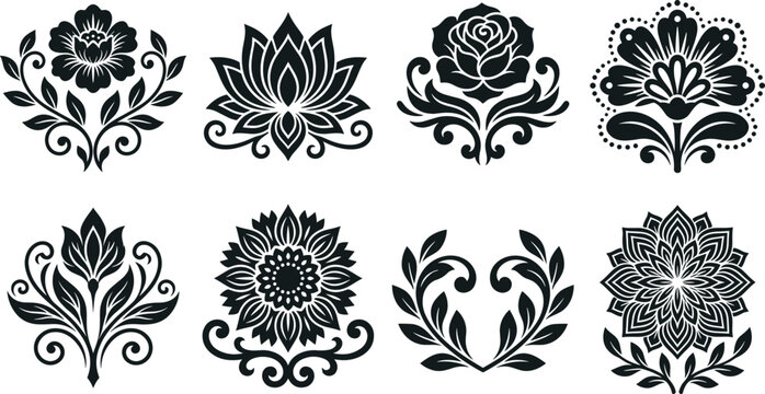 Collection of eight decorative floral ornaments and botanical silhouettes in black on a white background
