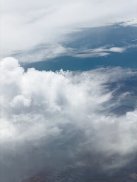 High-altitude view of clouds from airplane window