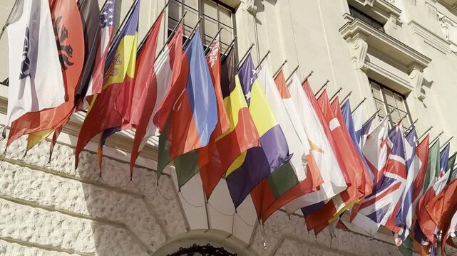 Flags of Many World Nations Displayed on Building