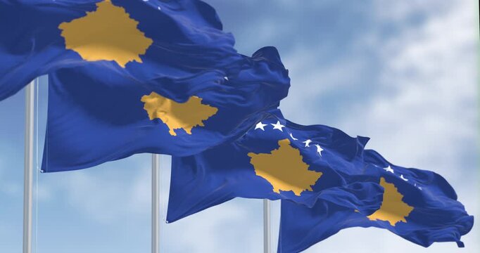 Kosovo national flags waving on a clear day