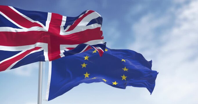 Flags of United Kingdom and the European Union waving in the wind
