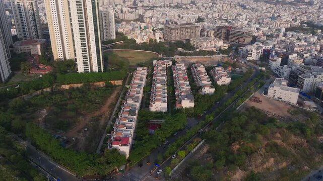 Lanco Hanging Gardens villas with lanco hills Residential Towers and aerial view of manikonda at hyderabad, telangana, india. day time, push in shot, drone shot, 4k.