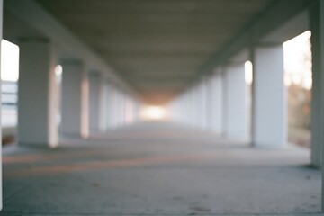 Obraz premium The Underpass Corridor of Columns with Vanishing Perspective at Dusk