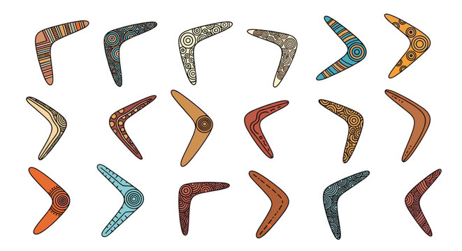 Large collection of eighteen colorful australian aboriginal boomerangs decorated with traditional tribal patterns.