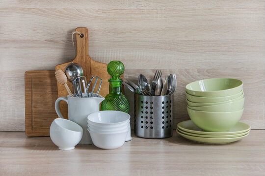 Cozy Kitchen Counter with Utensils and Crockery Display.