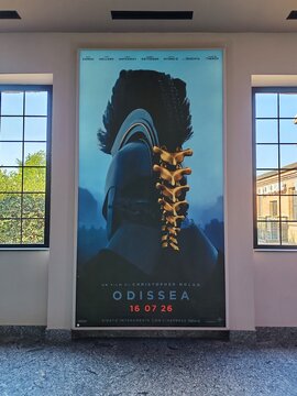 Ostia, Rome, Italy - July 22, 2026, advertising panel for director Christopher Nolan's film Odyssey, shot entirely with an IMAX camera, at Cineland Multiplex, Ostia's main multiplex cinema.