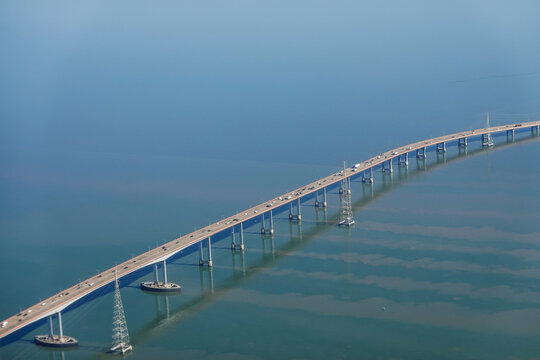 High aircraft window view of San Mateo Bridge in San Francisco