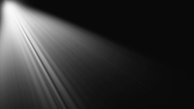 Single spotlight illuminating dark space with soft glowing beams and diffused light creating dramatic mood