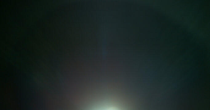 Abstract cinematic lens flare overlay with soft blue light rays, subtle optical glow and dark background. Premium VFX element for compositing, film editing, titles and motion graphics.