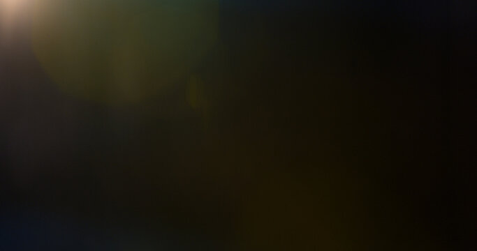 Abstract cinematic lens flare overlay with soft blue light rays, subtle optical glow and dark background. Premium VFX element for compositing, film editing, titles and motion graphics.