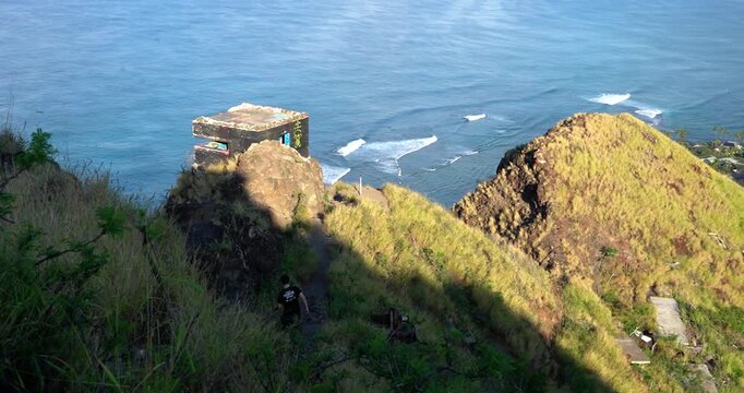 Man hiking to pillbox bunker on Oahu, Hawaii