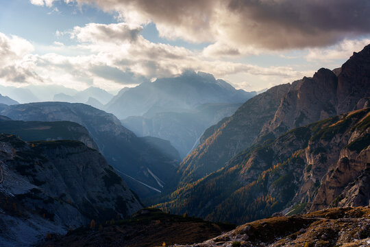 Dramatic Rugged Mountain Valley Landscape in the Dolomites at Autumn During Evening with Moody Clouds