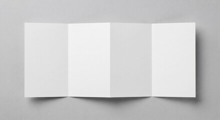 Naklejka premium Top-down view of a blank white four-panel accordion fold brochure laid flat on light grey textured background with soft shadows.