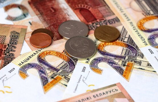 Belarusian ruble money banknotes and coins on table. Belarus cash bills of BYN currency