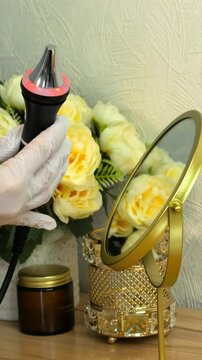 Professional beauty handpiece is presented on a decorative salon background, cosmetic equipment, skincare technology, elegant spa display.