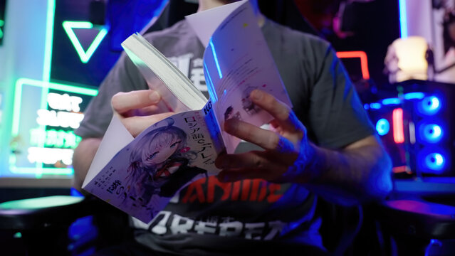 Person remove the colorful cover from Roshidere Japanese manga comic