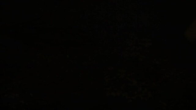 a Time lapse if the moon moving behind the clouds at night