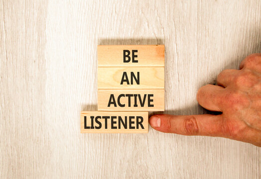 Be an active listener words symbol. Concept words Be an active listener on beautiful wooden blocks. Beautiful grey background. Businessman hand. Business be an active listener concept. Copy space.