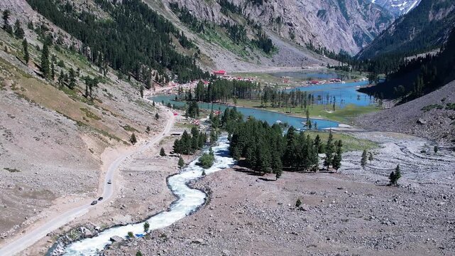 River flows through Upper Ushu Valley with forest and mountains in the Hindu Kush, Khyber Pakhtunkhwa, Pakistan