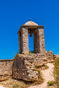 A view towards a bell tower in the Acronauplia, fortress above Nafplio in Greece in early summertime