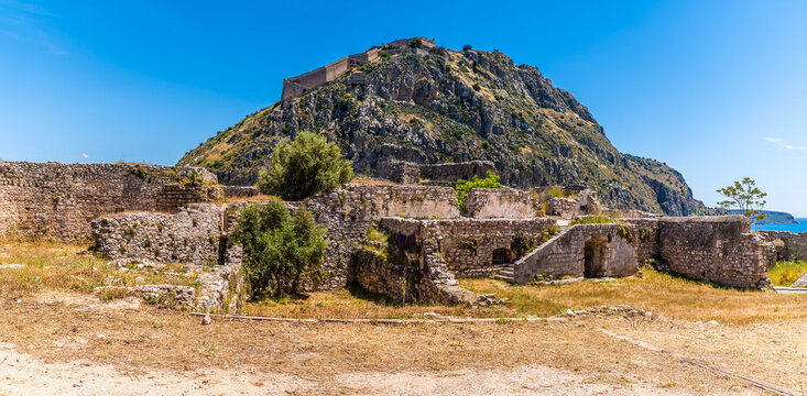 A panoramic view across the Acronauplia, fortress up with a backdrop of the Palamidi fortress above the old town in Nafplio in Greece in early summertime