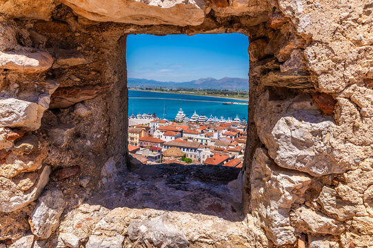 A view through an opening in the wall of the Acronauplia, fortress above the old town in Nafplio in Greece in early summertime