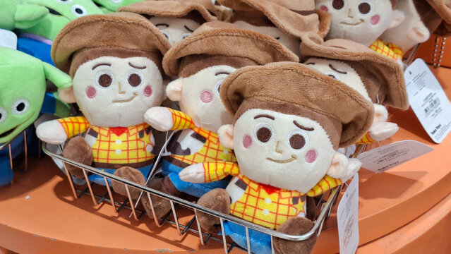 Group of cute Disney Pixar Toy Story Woody plush toys wearing cowboy hats sitting in wire basket display at retail shop on July 3, 2026 in Bangkok, Thailand.