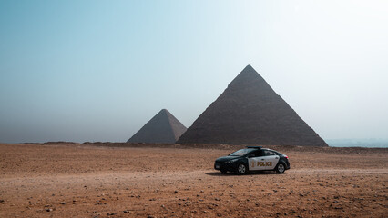 Giza pyramids panaroma with no people during day, Egypt, Cairo travel and police car © Юрий Крылов