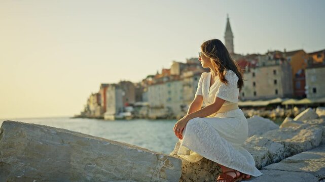 Woman Relaxing in Rovinj Croatia at Golden Sunset 4K Travel Lifestyle Video
