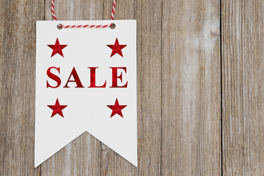 Sale text on white pennant banner hanging for festive events