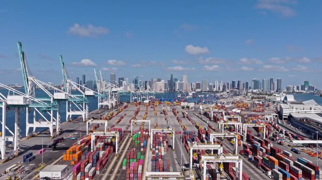 Miami, Florida, USA - May 21, 2025: Freight container cargo. Port of Miami. Container port loading. Export and import. Cargo business. Cargo services with container in Miami port terminal