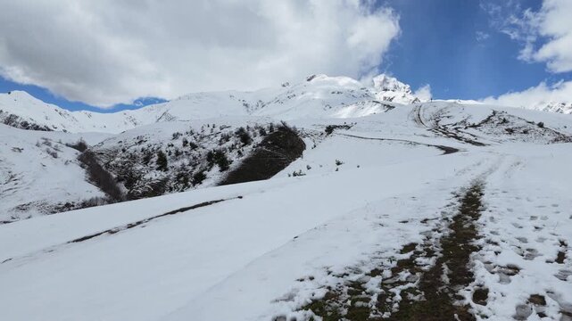 Panoramic view of snow covered Koruldi ridge in Svaneti Georgia, majestic mountain peaks, alpine adventure, hiking trails in winter