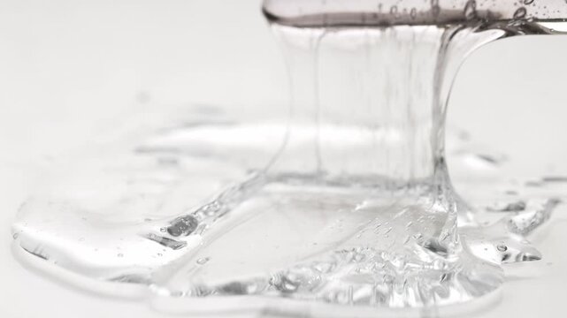 Texture of cosmetic gel, sample of liquid product for beauty treatments.